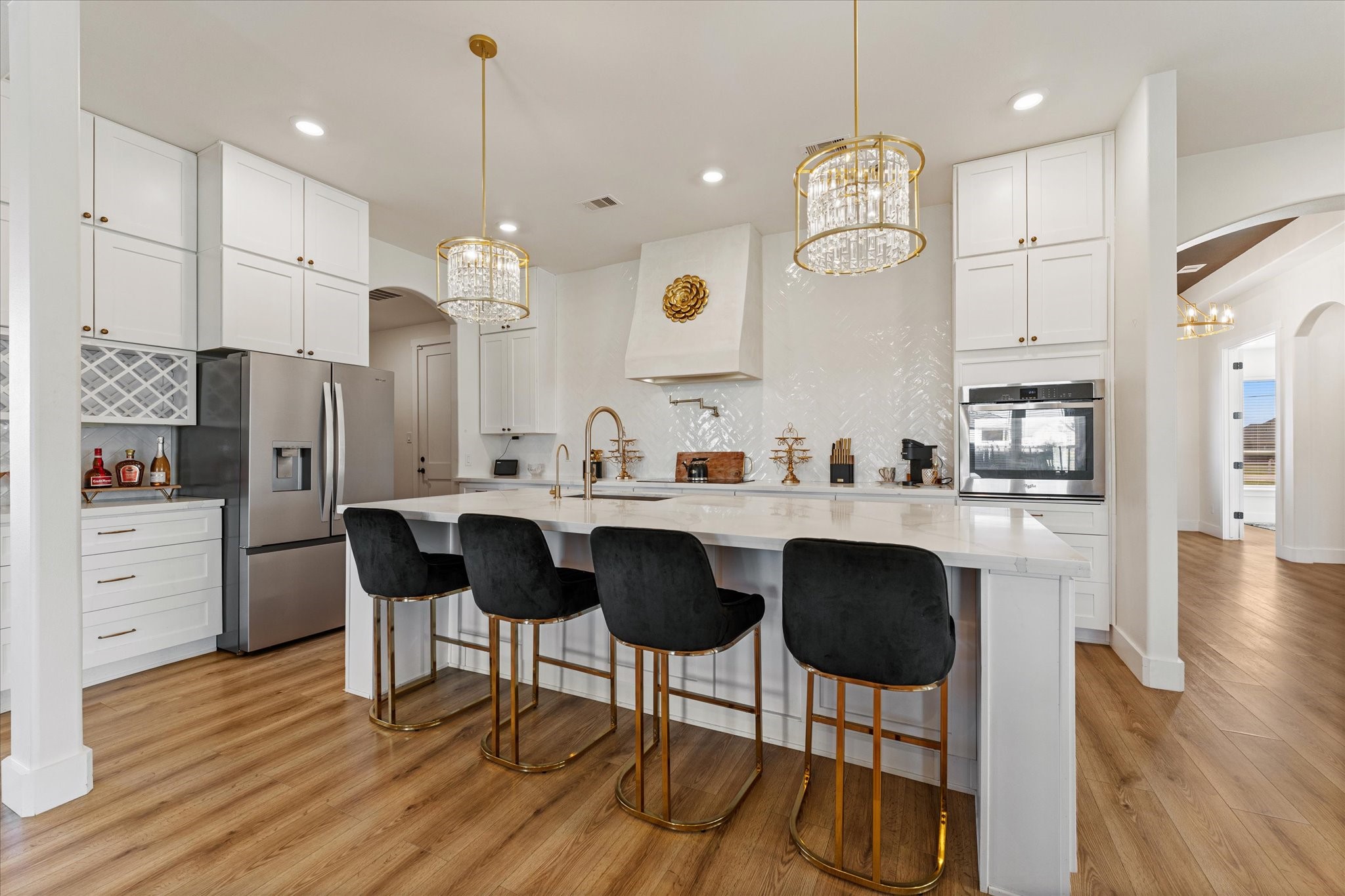 4627 County Road 63 Rosharon, TX 77583 - Photo 8 of 34 a kitchen with stainless steel appliances granite countertop a sink a stove a refrigerator and island with wooden floor