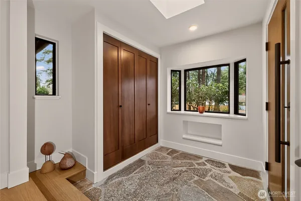 a view of an entryway with wooden floor
