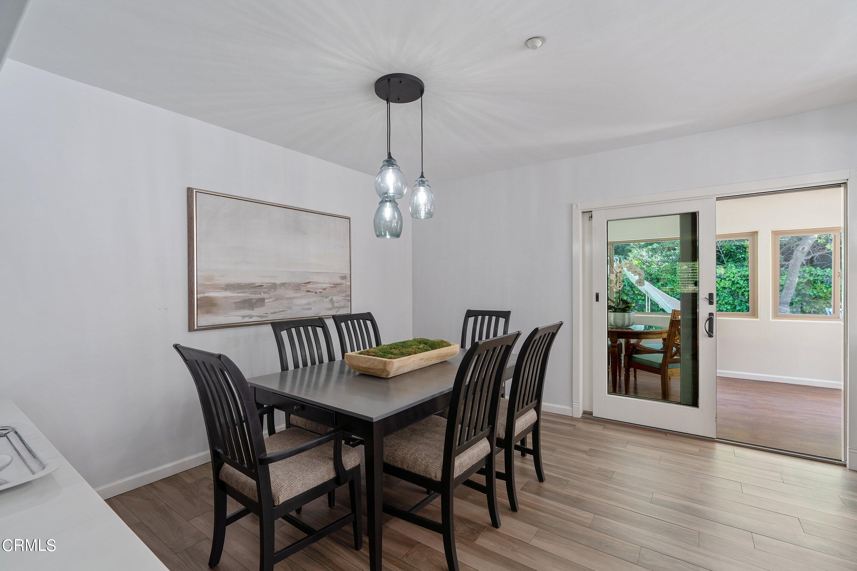 3710 Cedarbend Drive La Crescenta, CA 91214 - Photo 26 of 73 a view of a dining room with furniture window and wooden floor