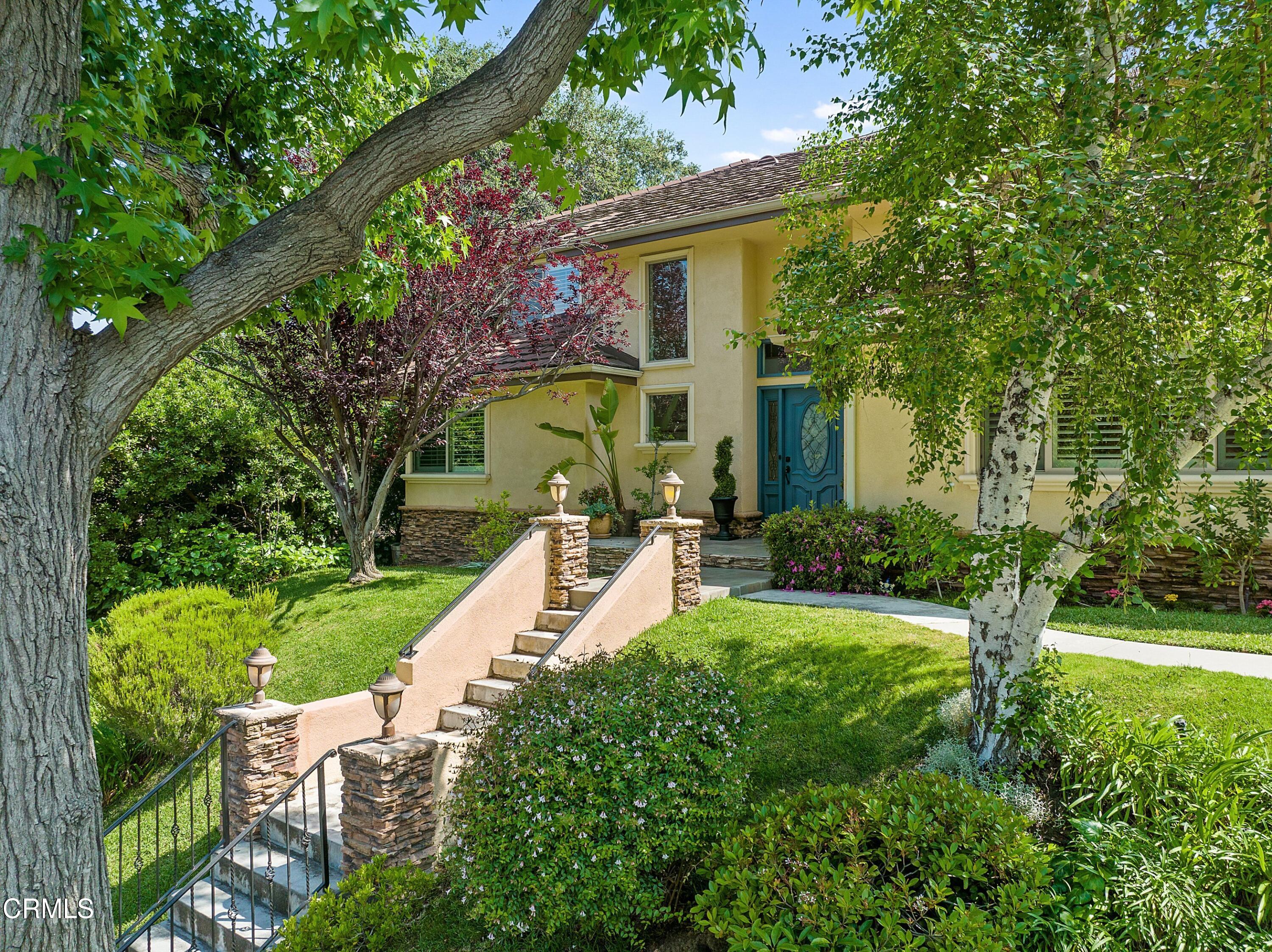 3710 Cedarbend Drive La Crescenta, CA 91214 - Photo 3 of 73 a view of a house with a yard and potted plants
