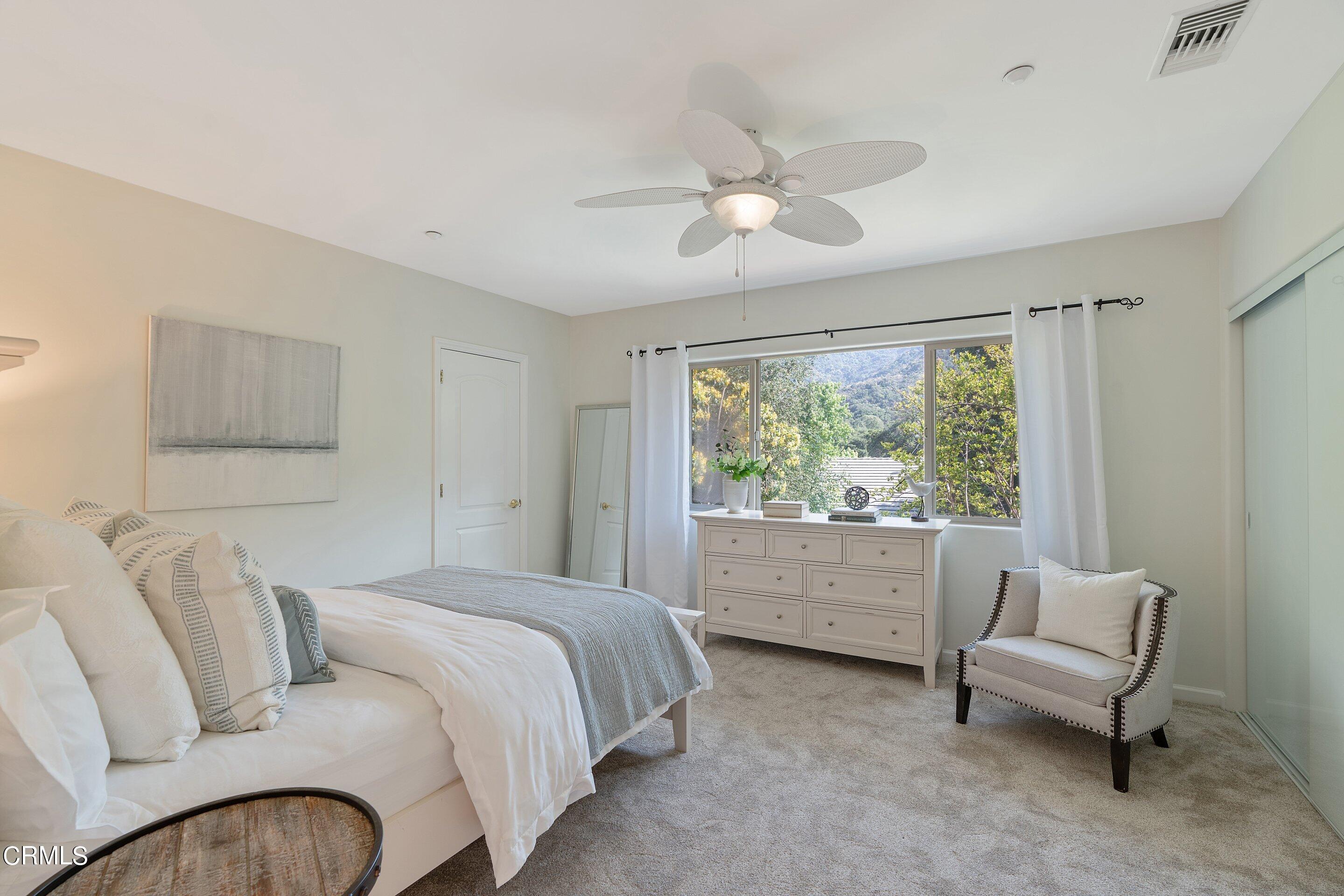 3710 Cedarbend Drive La Crescenta, CA 91214 - Photo 47 of 73 a spacious bedroom with a bed and a large window