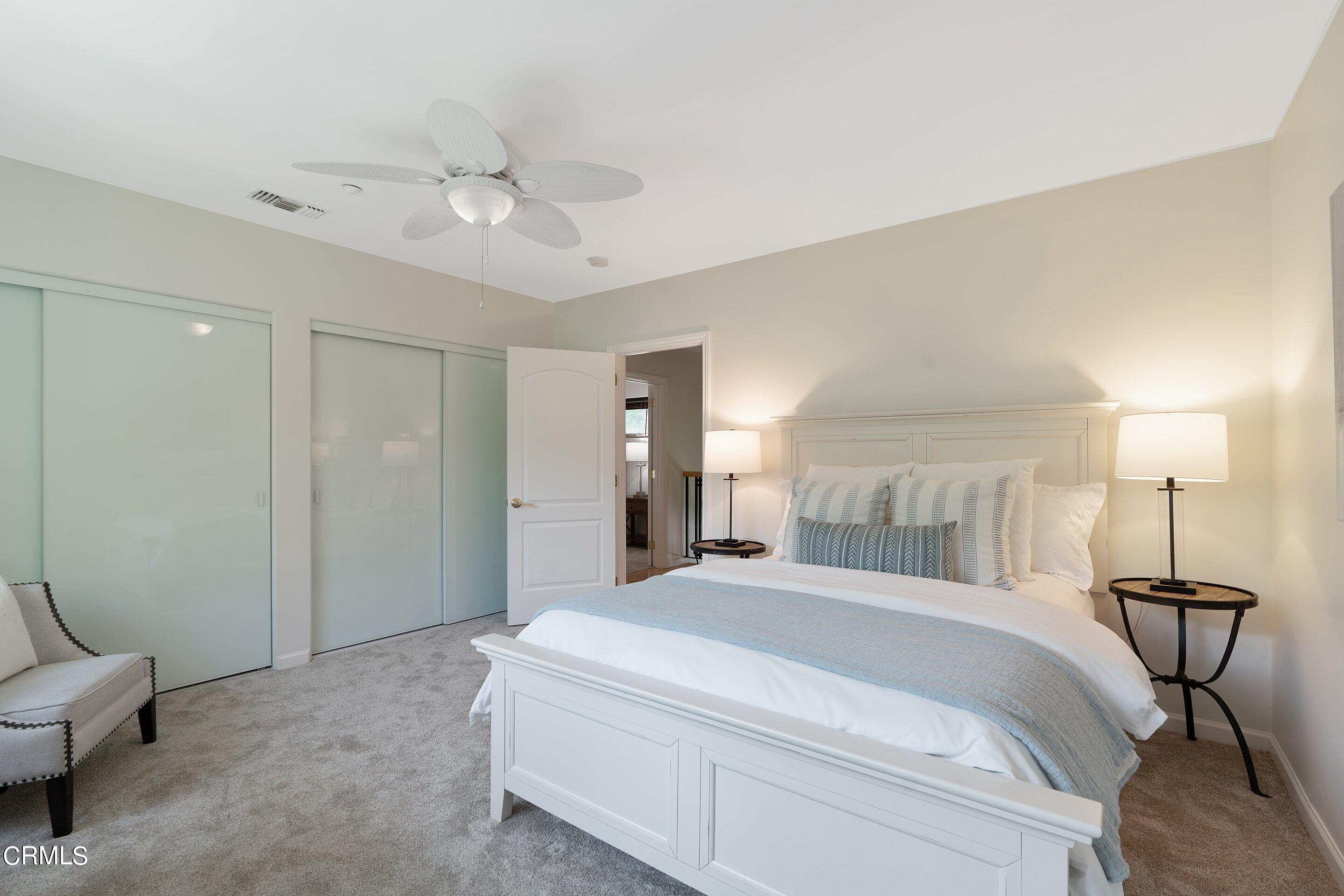 3710 Cedarbend Drive La Crescenta, CA 91214 - Photo 49 of 73 a spacious bedroom with a bed and a chandelier