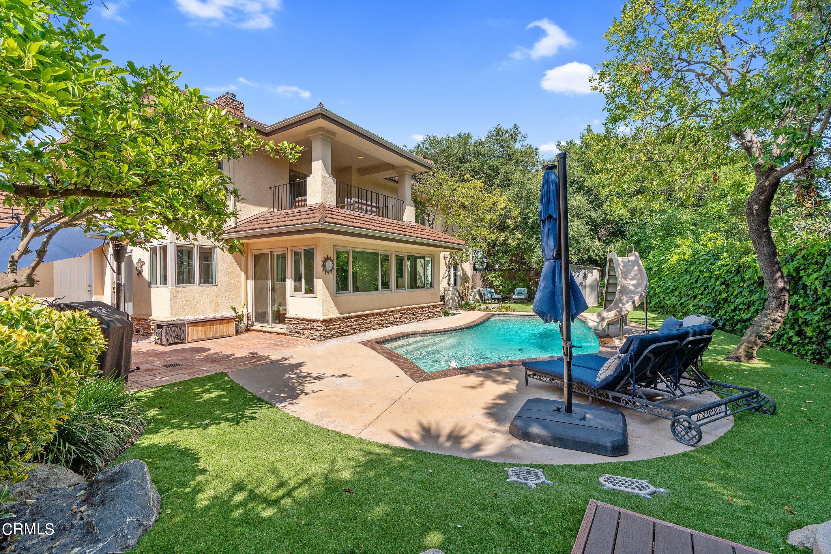 3710 Cedarbend Drive La Crescenta, CA 91214 - Photo 64 of 73 a front view of a house with garden and trees