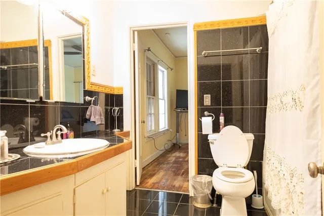a bathroom with a sink toilet and shower