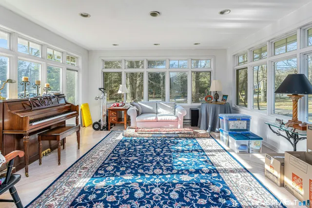 a living room with furniture and a rug