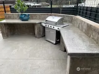 a stove top oven sitting inside of a kitchen