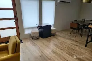 a bedroom with furniture and a window