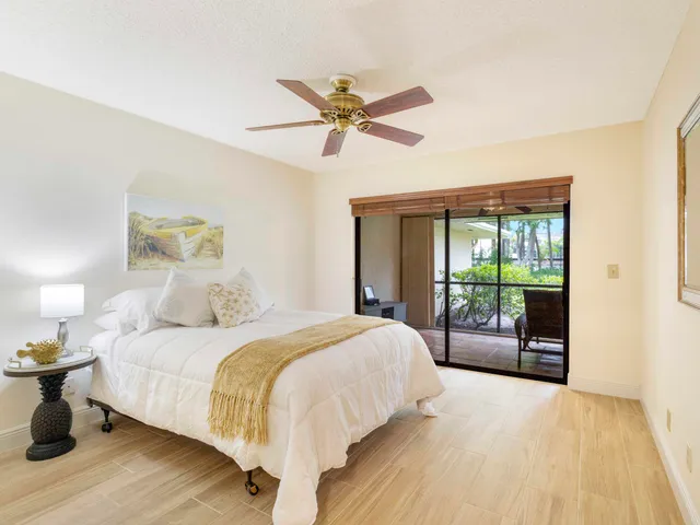 a bathroom with a granite countertop sink and a large mirror