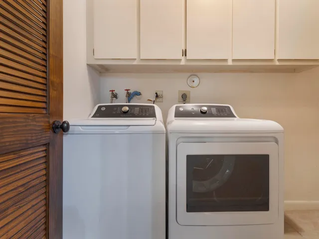 a bathroom with a sink a mirror and a vanity