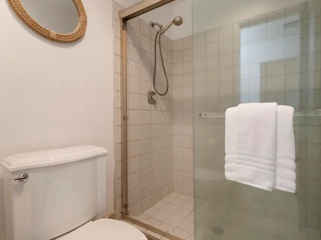 a bed room with a bed and a chair