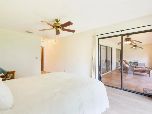 a living room with lots of furniture and kitchen view
