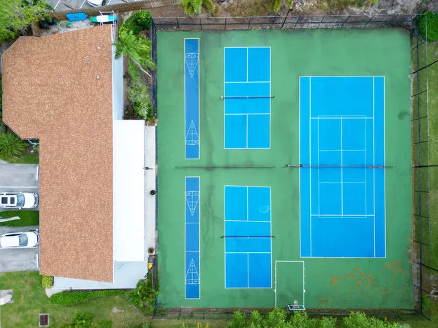 a front view of a house with yard and green space