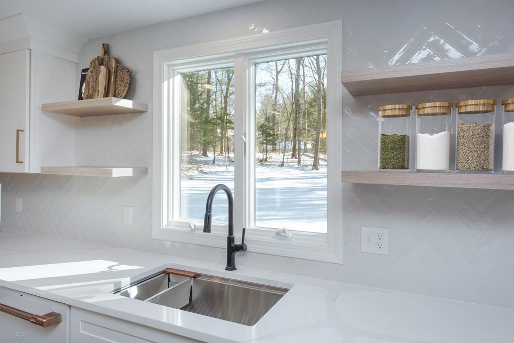 143 Hillcrest Road Concord, MA 01742 - Photo 14 of 42 a kitchen with a sink and a window
