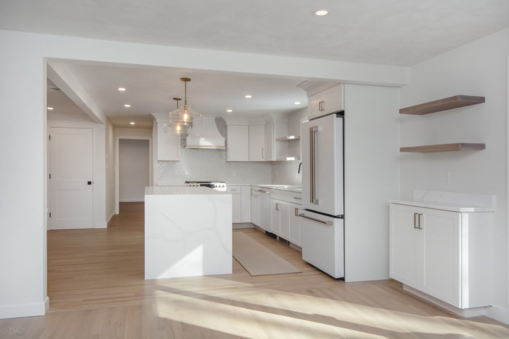 143 Hillcrest Road Concord, MA 01742 - Photo 16 of 42 a kitchen with a refrigerator and a stove top oven