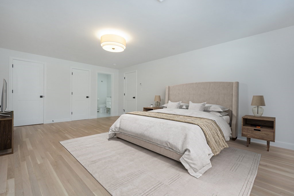 143 Hillcrest Road Concord, MA 01742 - Photo 23 of 42 a bedroom with a bed and a night stand