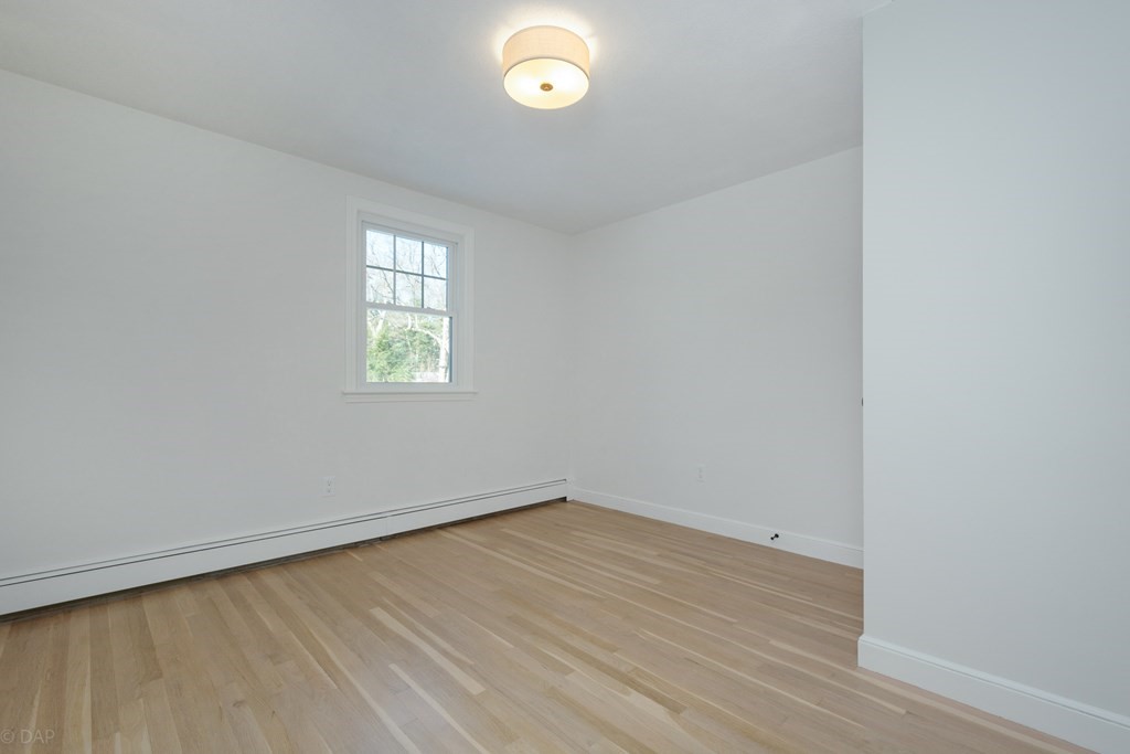 143 Hillcrest Road Concord, MA 01742 - Photo 26 of 42 an empty room with a window