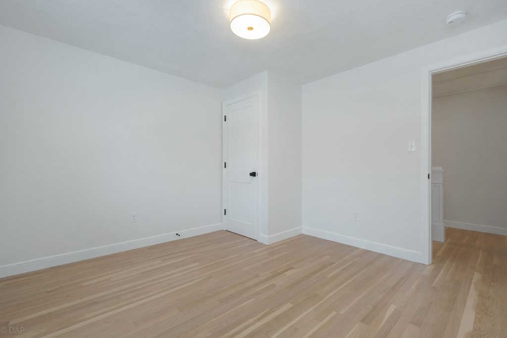 143 Hillcrest Road Concord, MA 01742 - Photo 27 of 42 wooden floor in an empty room