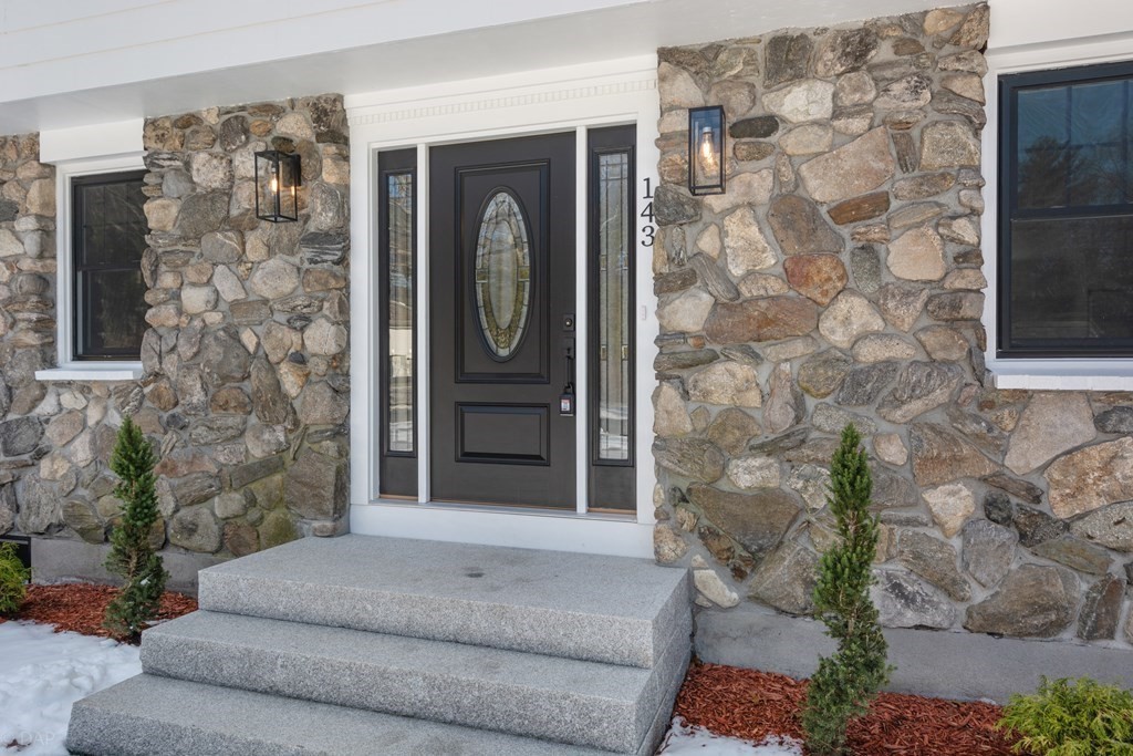 143 Hillcrest Road Concord, MA 01742 - Photo 3 of 42 a living room with furniture and a fireplace