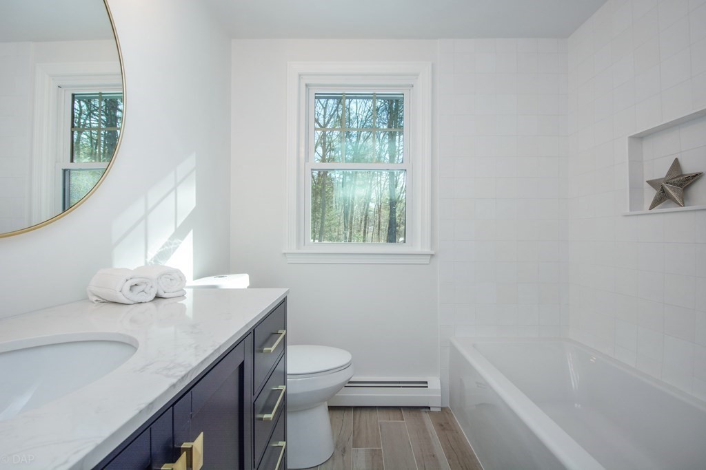 143 Hillcrest Road Concord, MA 01742 - Photo 33 of 42 a bathroom with a sink toilet and shower