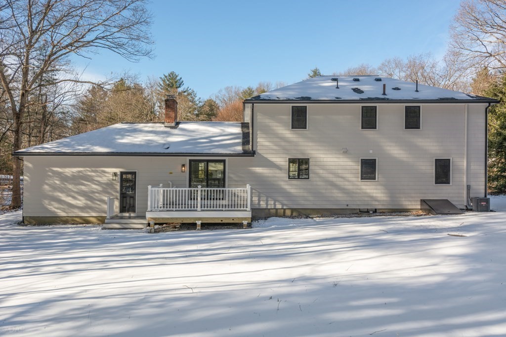 143 Hillcrest Road Concord, MA 01742 - Photo 39 of 42 a front view of a house with a garden