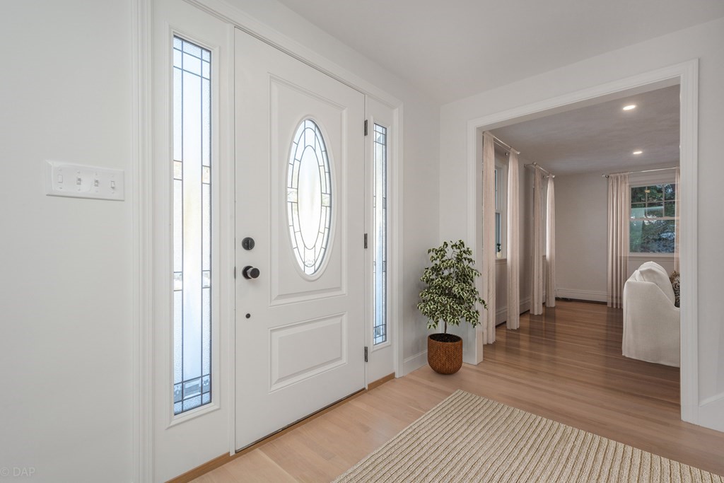 143 Hillcrest Road Concord, MA 01742 - Photo 4 of 42 a view of livingroom with entryway and wooden floor