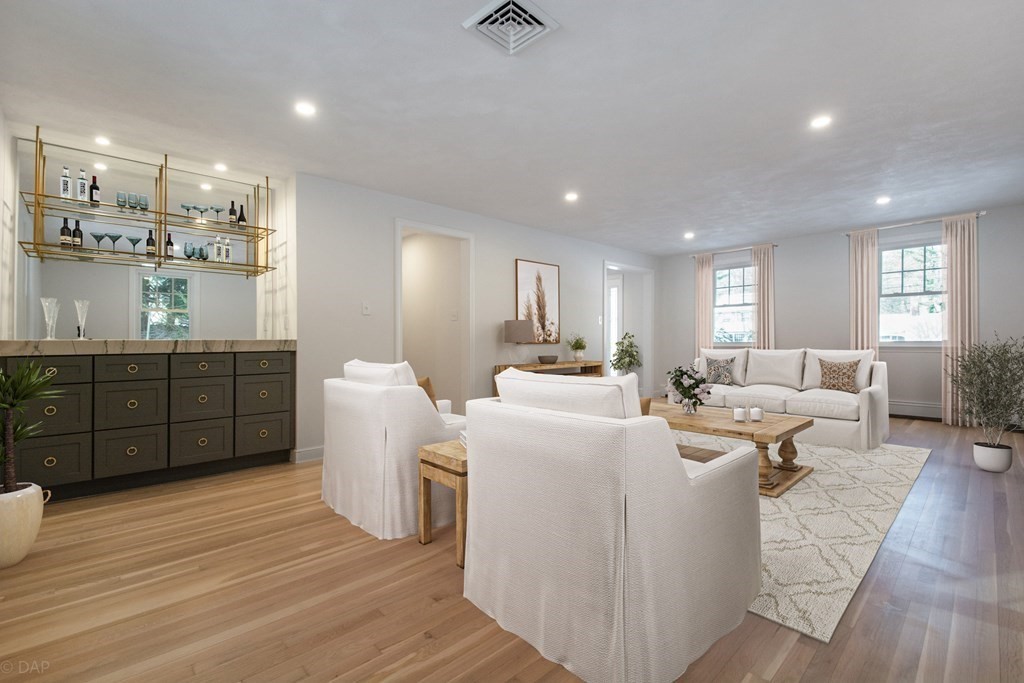 143 Hillcrest Road Concord, MA 01742 - Photo 7 of 42 a living room with furniture and a wooden floor