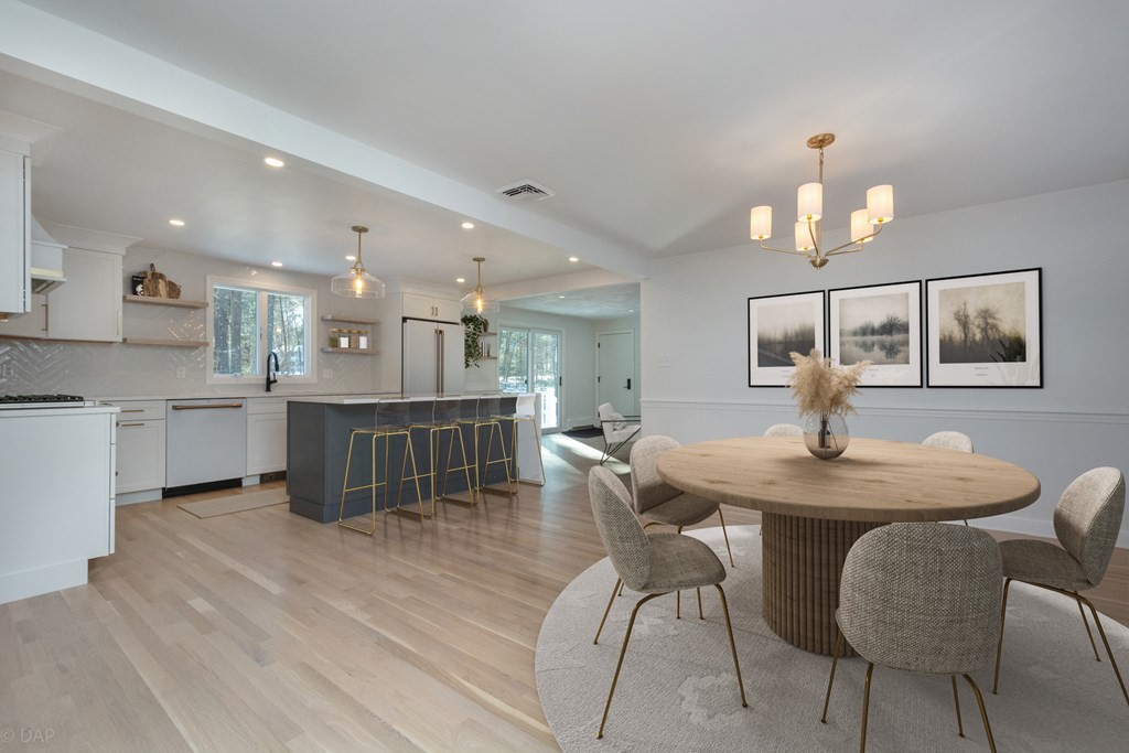 143 Hillcrest Road Concord, MA 01742 - Photo 10 of 42 a view of a dining room with furniture and wooden floor