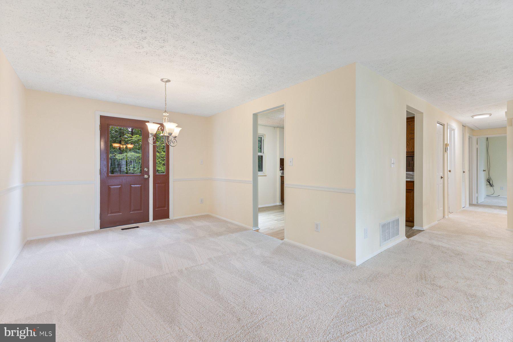 8011 Treasure Tree Court Springfield, VA 22153 - Photo 13 of 31 an empty room with fan and windows