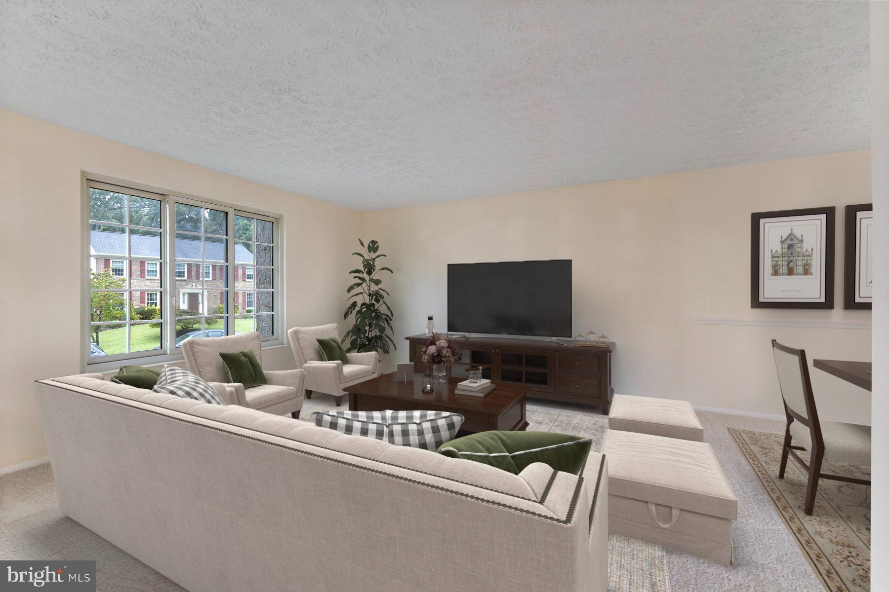 8011 Treasure Tree Court Springfield, VA 22153 - Photo 2 of 31 a living room with furniture and a flat screen tv