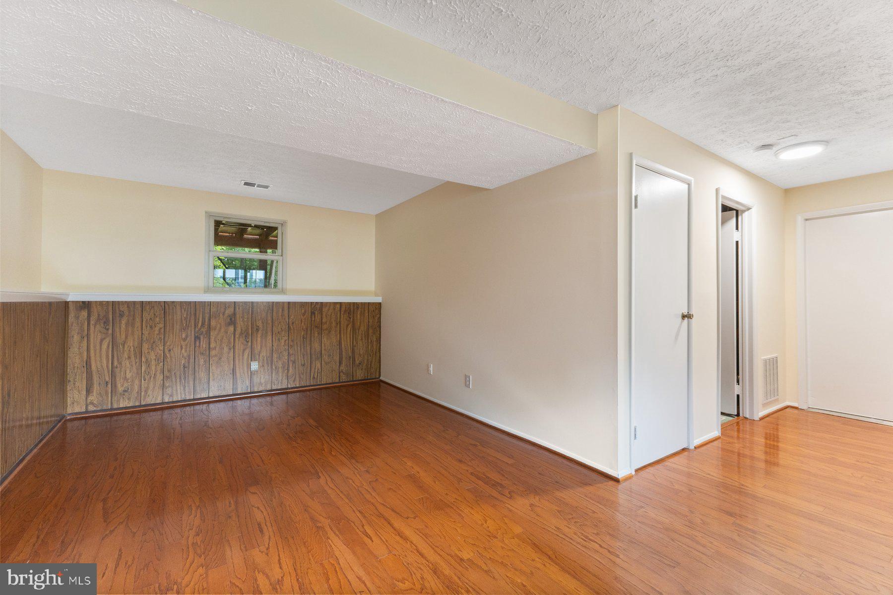 8011 Treasure Tree Court Springfield, VA 22153 - Photo 25 of 31 a view of a room with wooden floor