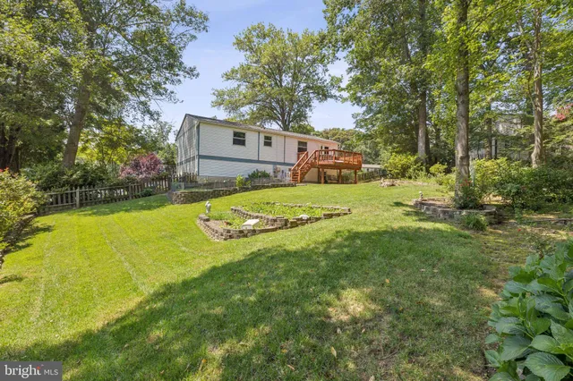 a view of a yard with a house in the background