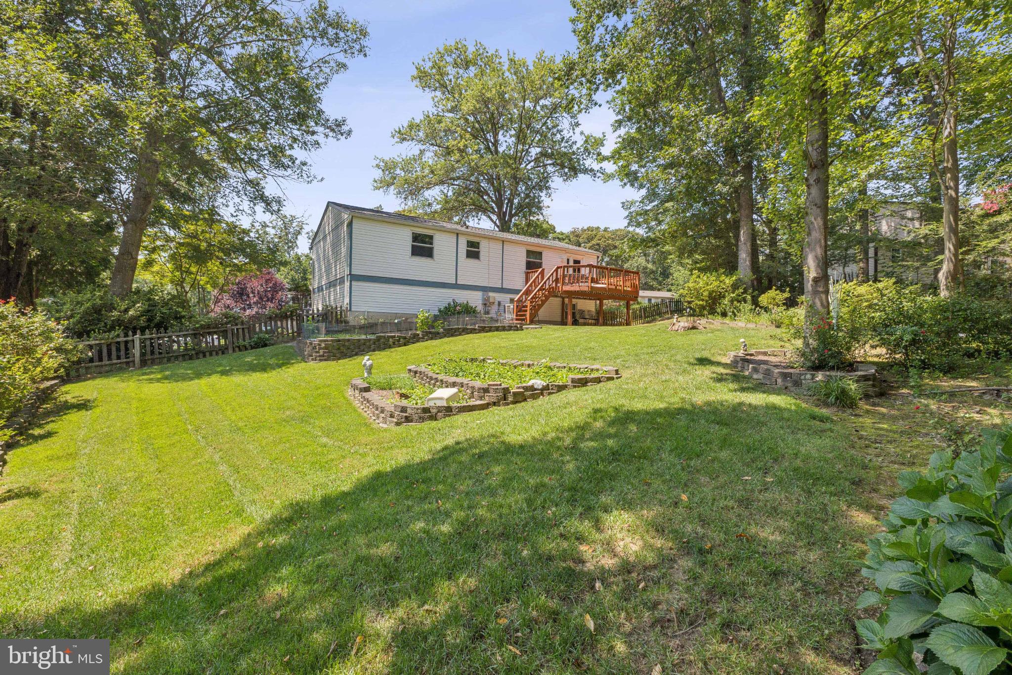 8011 Treasure Tree Court Springfield, VA 22153 - Photo 28 of 31 a view of a yard with a house in the background