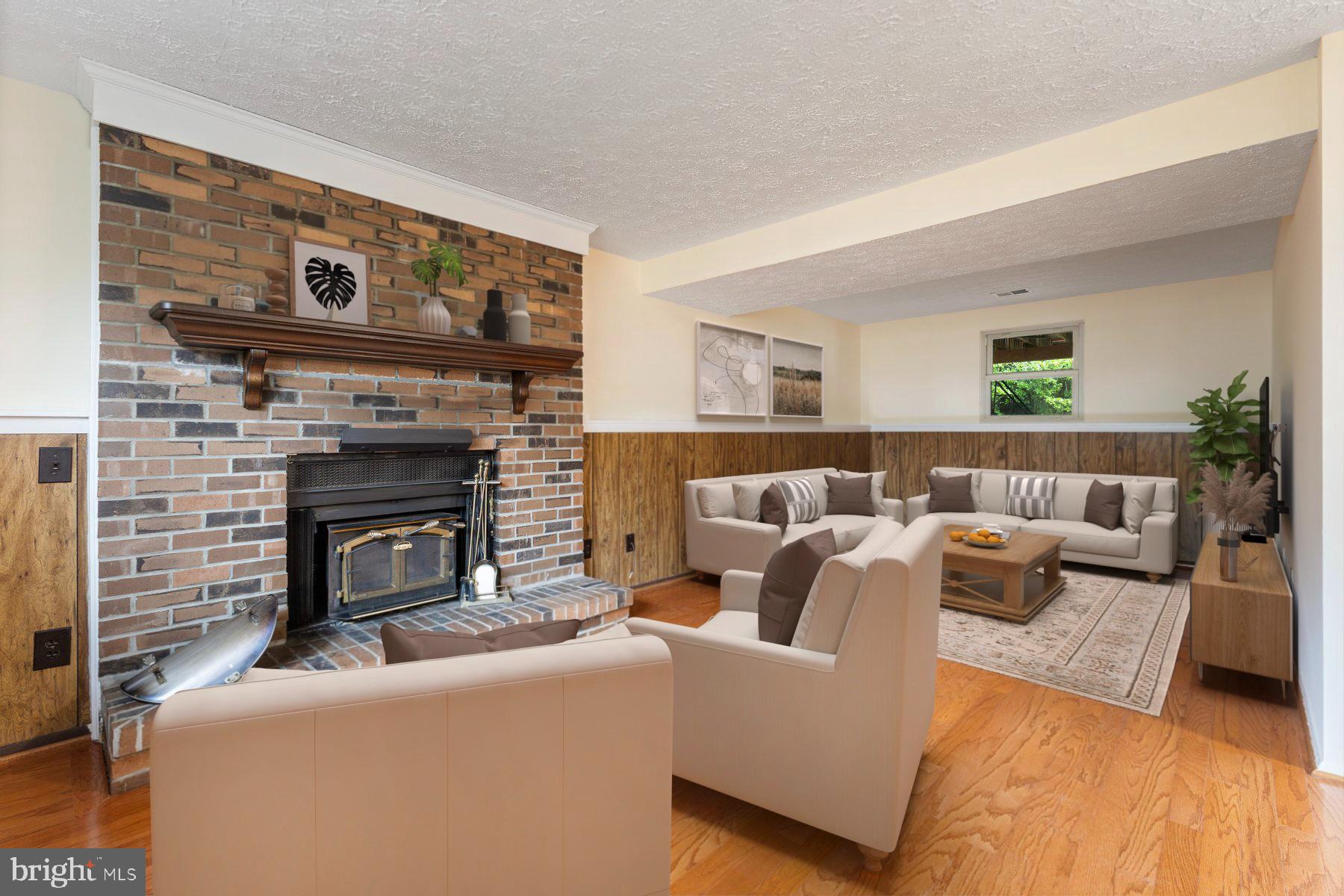 8011 Treasure Tree Court Springfield, VA 22153 - Photo 5 of 31 a living room with furniture and a fireplace