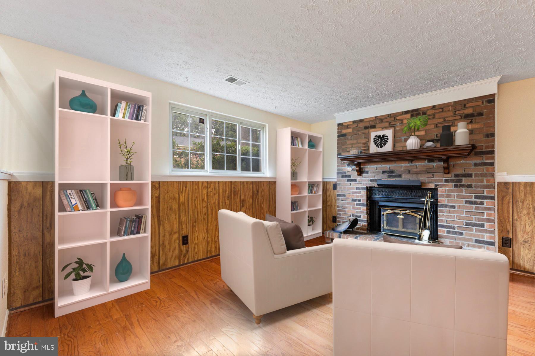 8011 Treasure Tree Court Springfield, VA 22153 - Photo 6 of 31 a living room with furniture and a fireplace