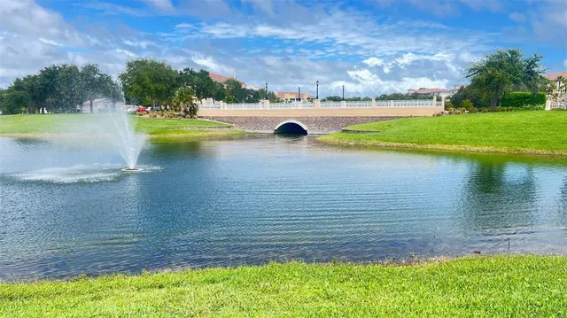 a view of swimming pool with outdoor seating and plants