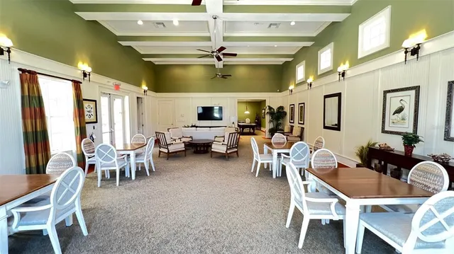 a view of a chairs and table on the patio