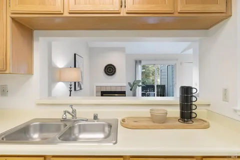 a kitchen with a sink and a window
