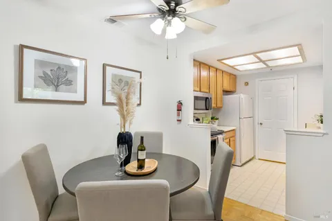 a dining room with furniture and window