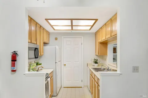 a bathroom with a sink a mirror and a shower