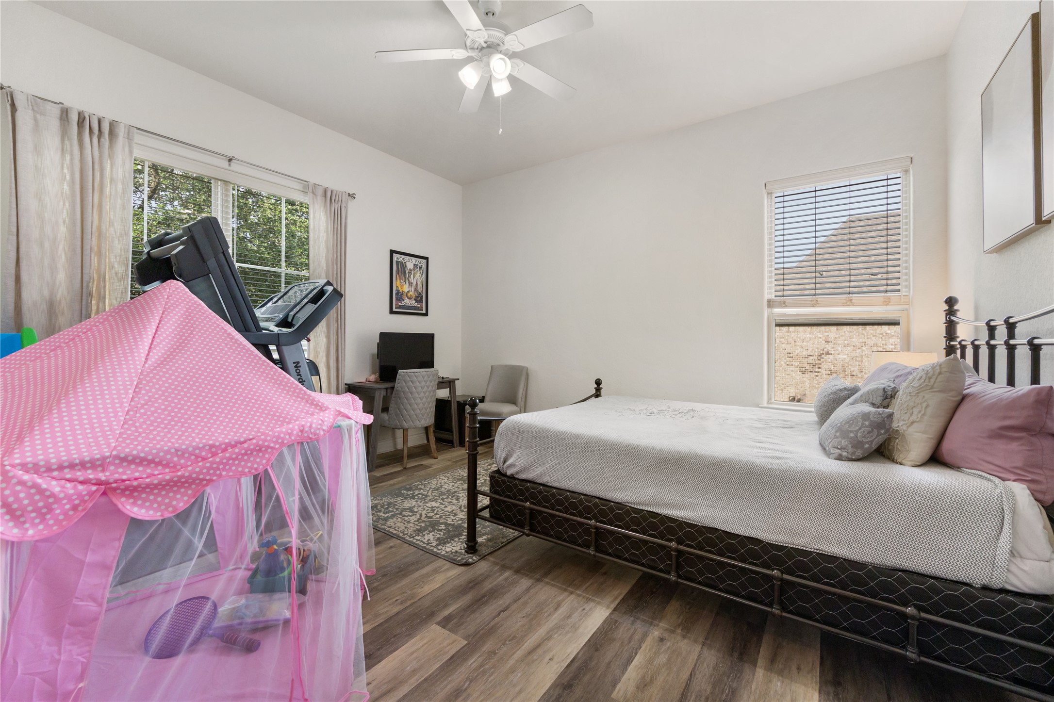 415 Bitterroot Lane Austin, TX 78737 - Photo 16 of 25 Comfortable bedroom with ample natural illumination, offering a peaceful retreat.