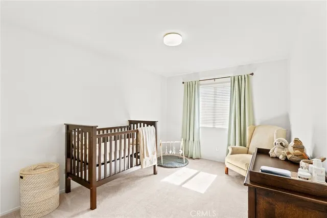 a spacious bedroom with a bed and a window