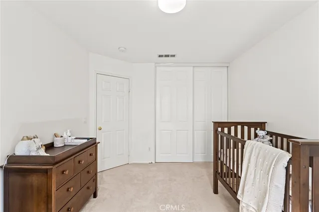 a view of a room with lots of cabinet mirror and a bathtub