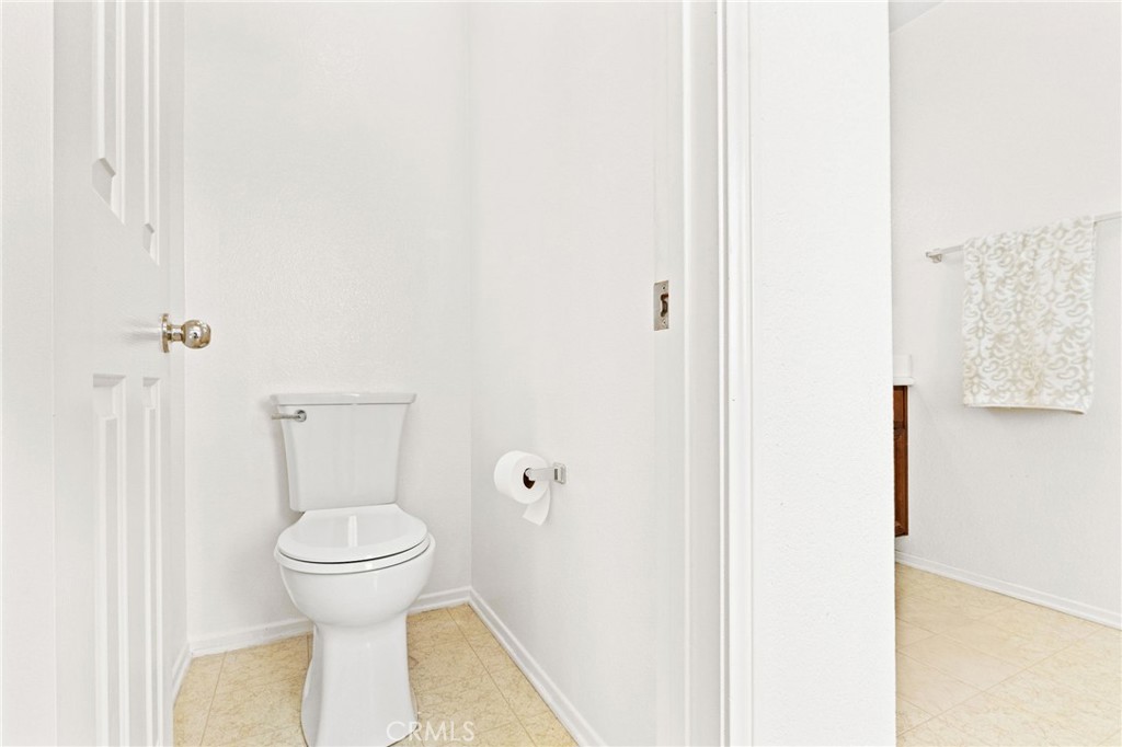 29225 Hydrangea Street Murrieta, CA 92563 - Photo 23 of 38 a bathroom with a toilet and a sink