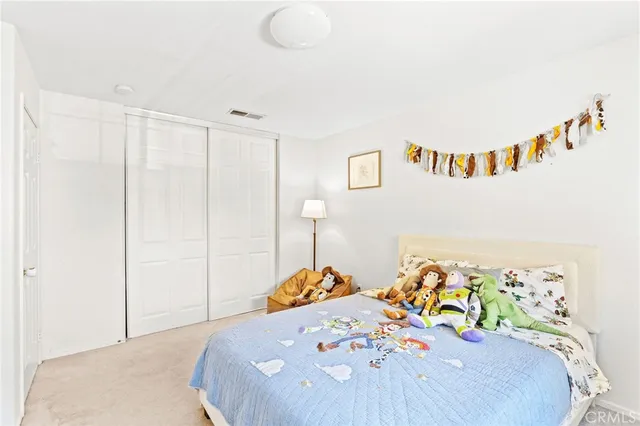 a bedroom with a bed and a table