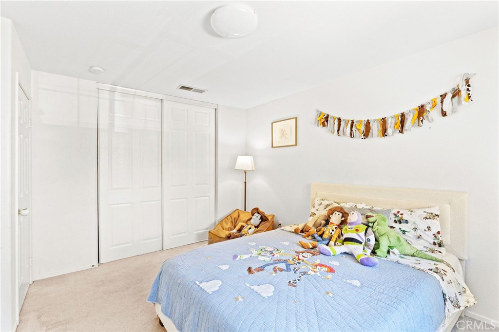 29225 Hydrangea Street Murrieta, CA 92563 - Photo 26 of 38 a bedroom with a bed and a table