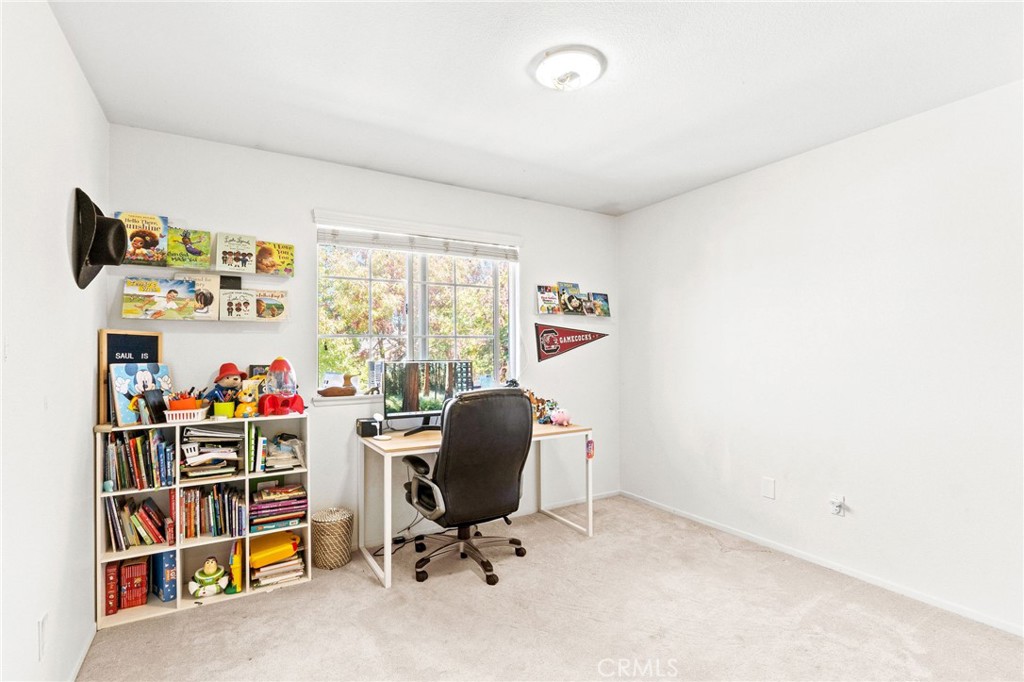 29225 Hydrangea Street Murrieta, CA 92563 - Photo 27 of 38 a view of a workspace with furniture and a window