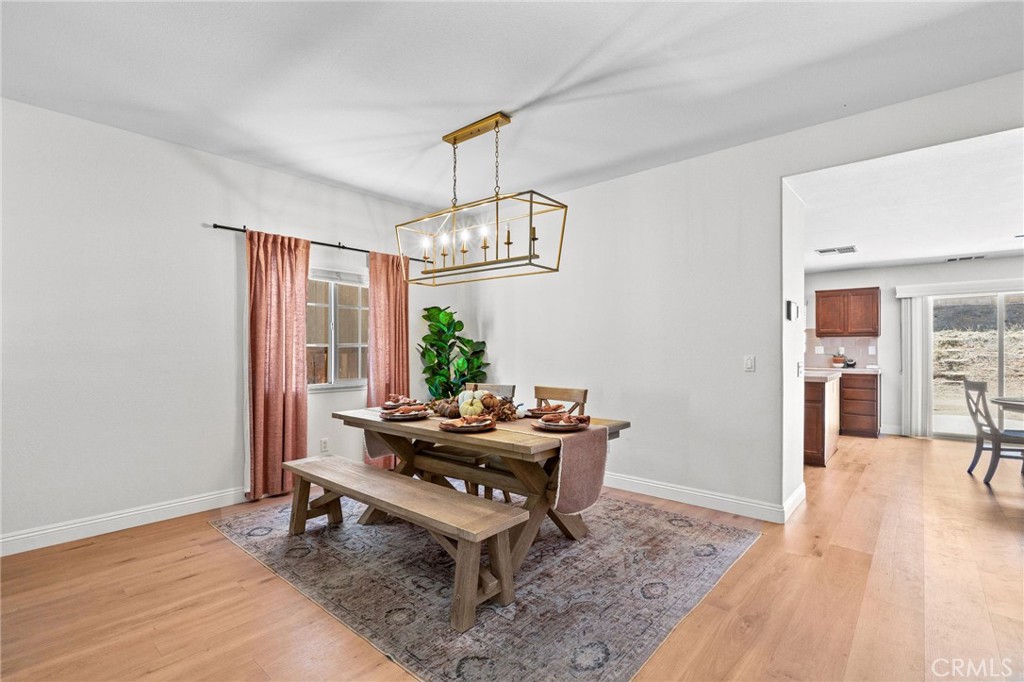29225 Hydrangea Street Murrieta, CA 92563 - Photo 3 of 38 a living room with furniture and a table