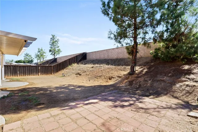 a view of a backyard of the house