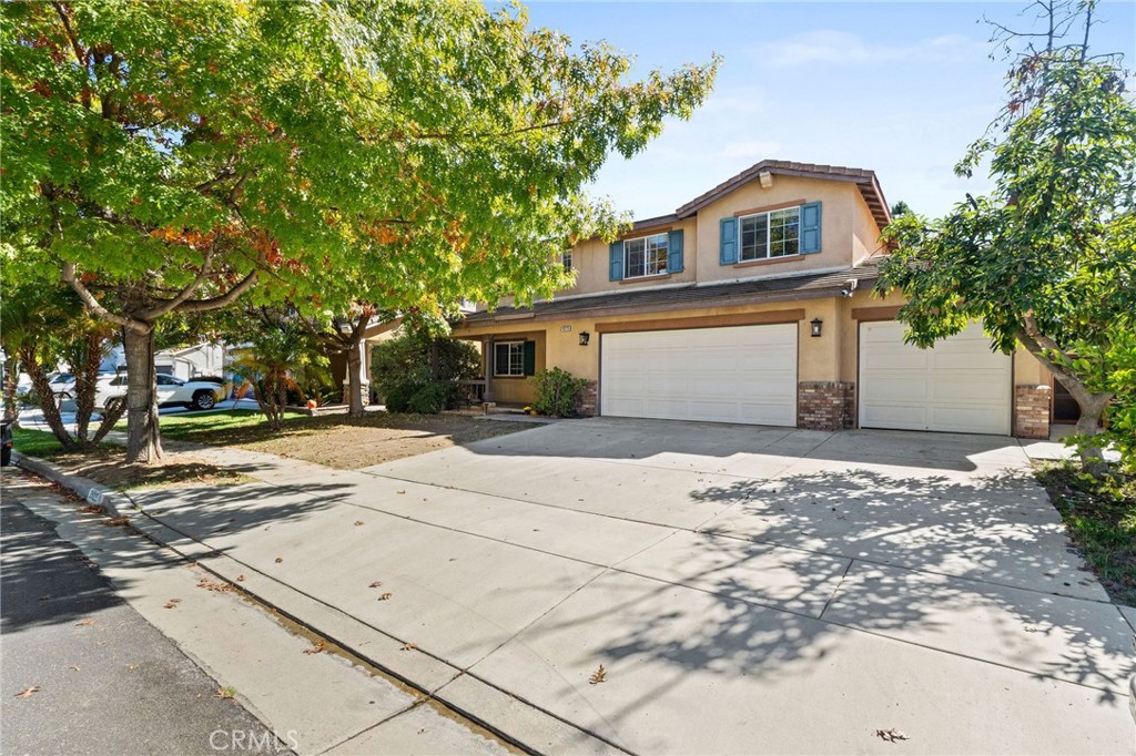 29225 Hydrangea Street Murrieta, CA 92563 - Photo 36 of 38 a front view of a house with a yard and trees