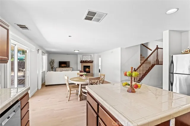 a living room with furniture a flat screen tv and a table